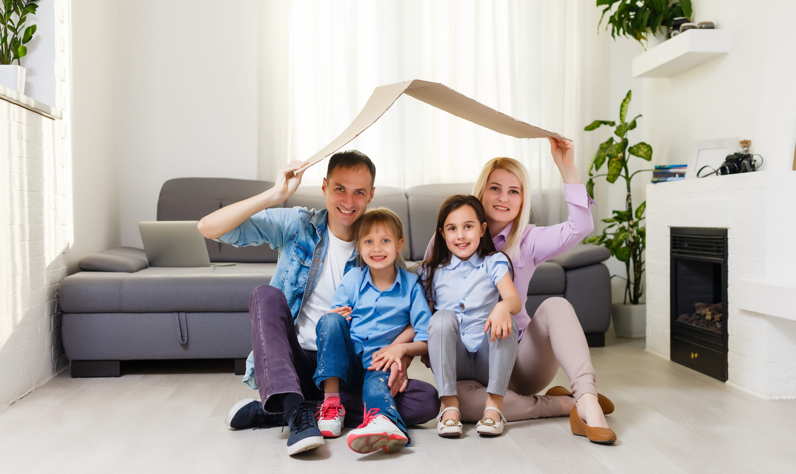 Portrait,Of,A,Happy,Family,Smiling,At,Home